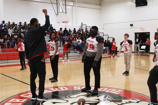 Defense demonstrating defensive plays at the pep rally!
